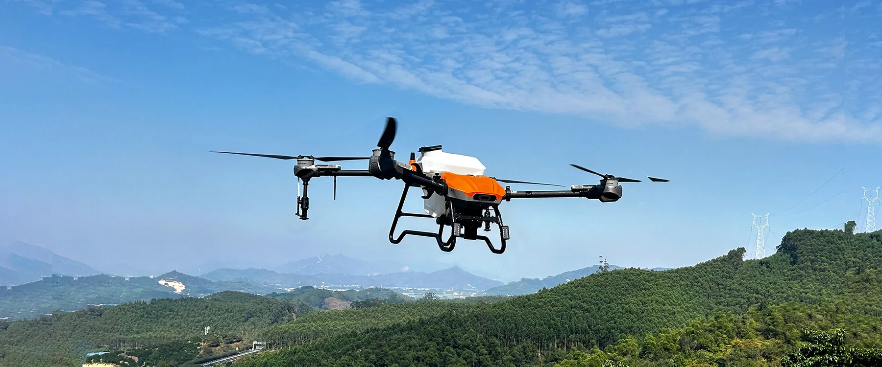 HD580 drone in flight over farmland